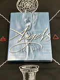 The Book of Angels by Francis Melville, featuring a textured light blue cover with a silver-toned angel statue and elegant white script title, displayed on a black background with white line drawings.