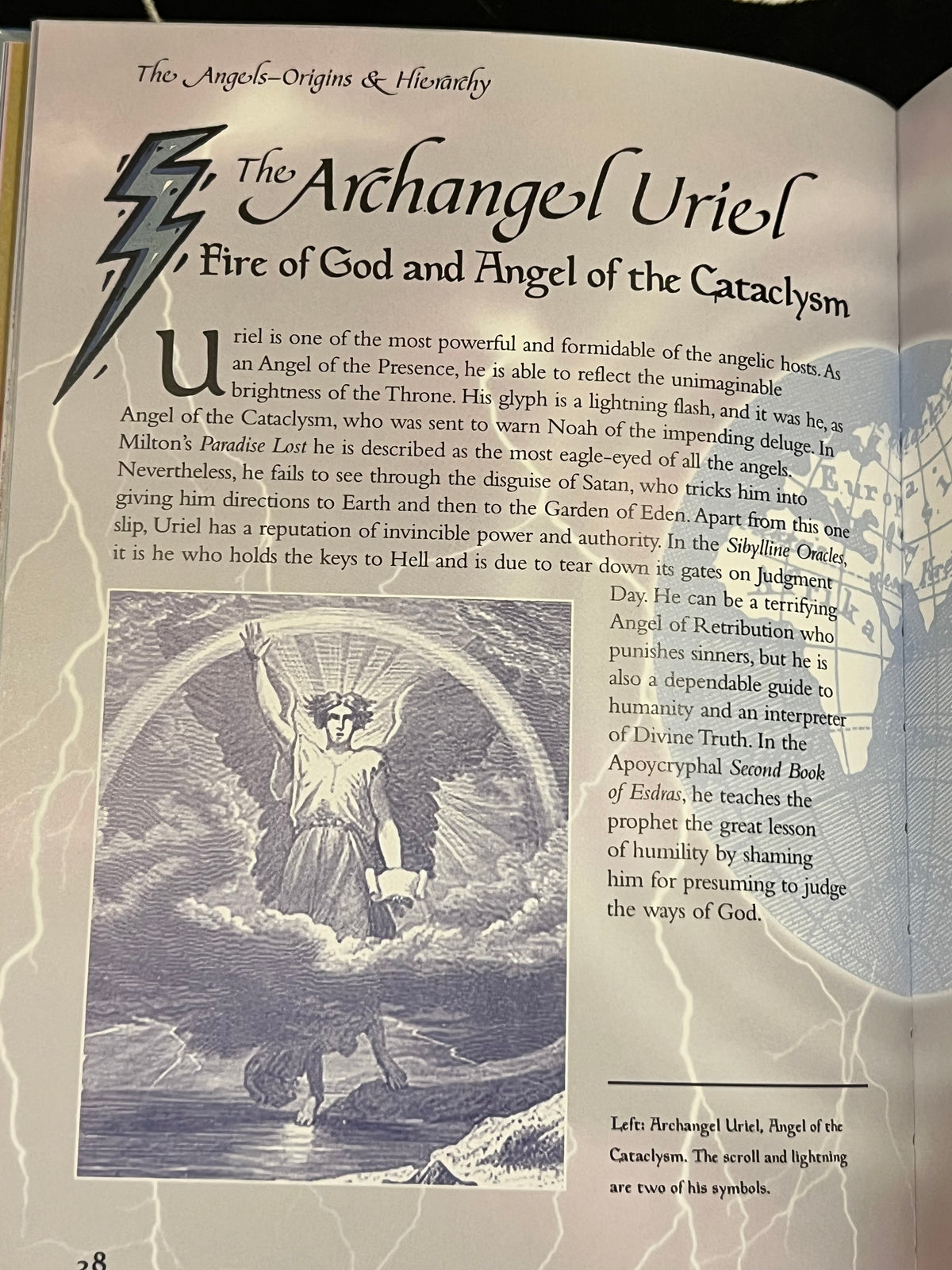 An open book page featuring printed text about 'The Archangel Uriel' with a large lightning bolt illustration and a grayscale angel artwork, photographed against a light neutral background.