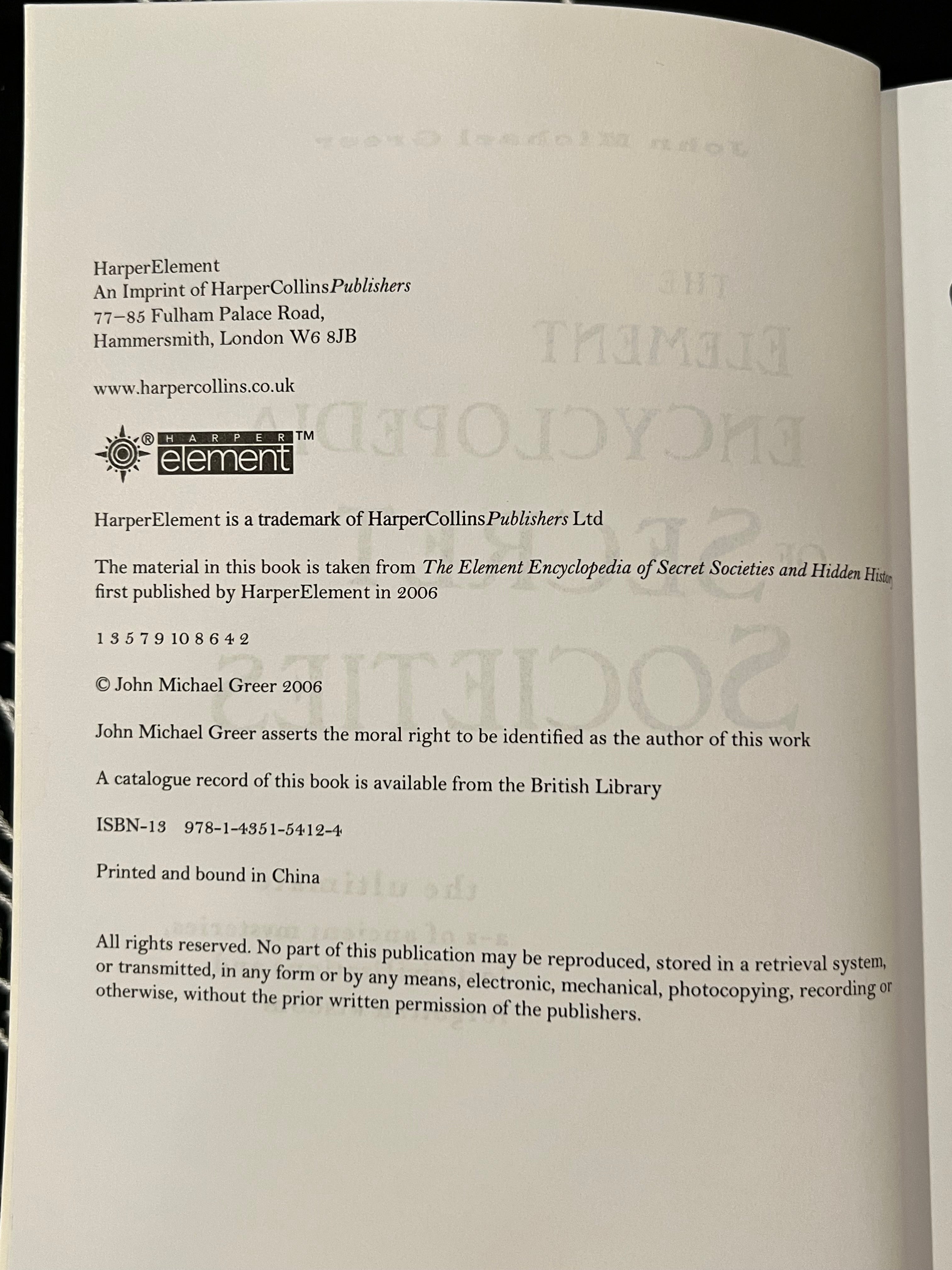 A close-up of an open book's printed interior page showing publisher information and copyright text for HarperCollinsPublishers and the British Library.