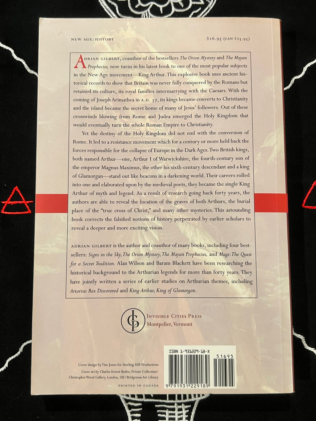 The back cover of a book titled 'The Age of Kings' by Adrian Gilbert, published by Interscope Books Press. The cover is cream-colored with black text, featuring a central title block, an abstract preview, a barcode, and a black-and-white photographic strip along the bottom edge.