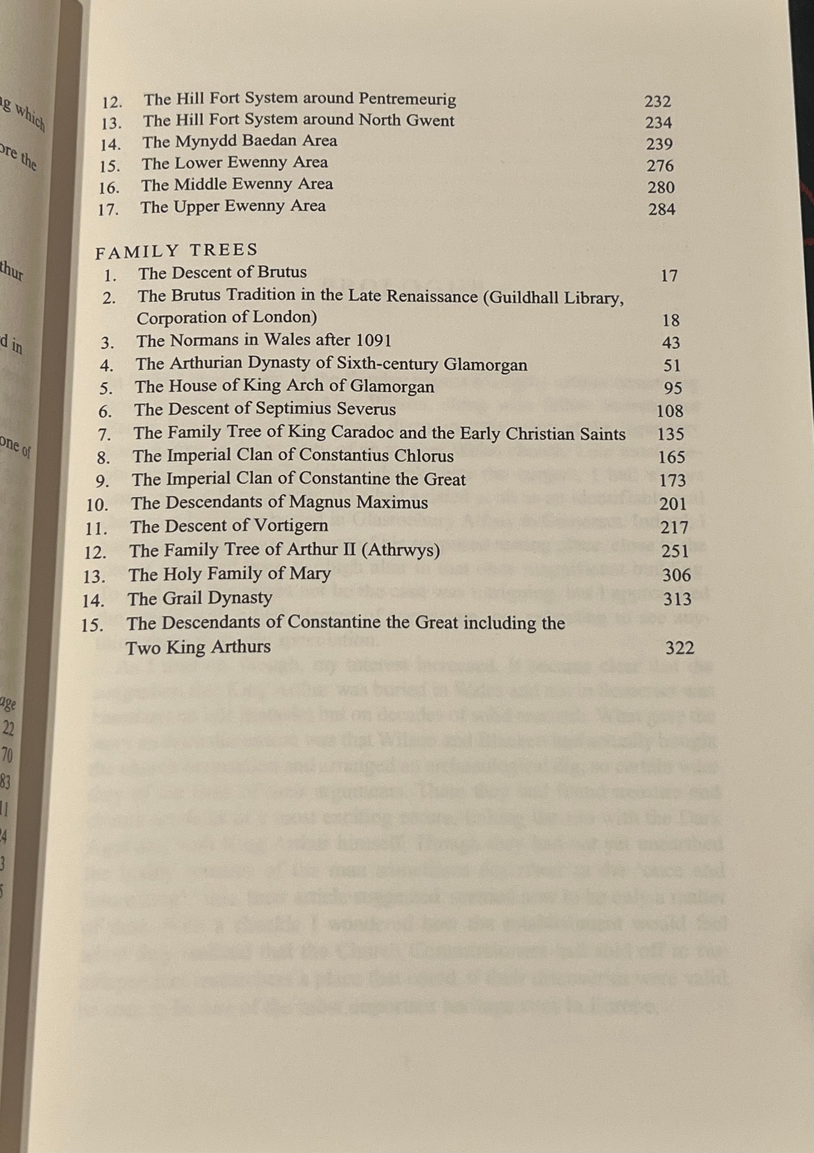 A close-up of an open book showing printed text pages, including headings such as 'Family Trees' and numbered entries with page numbers.