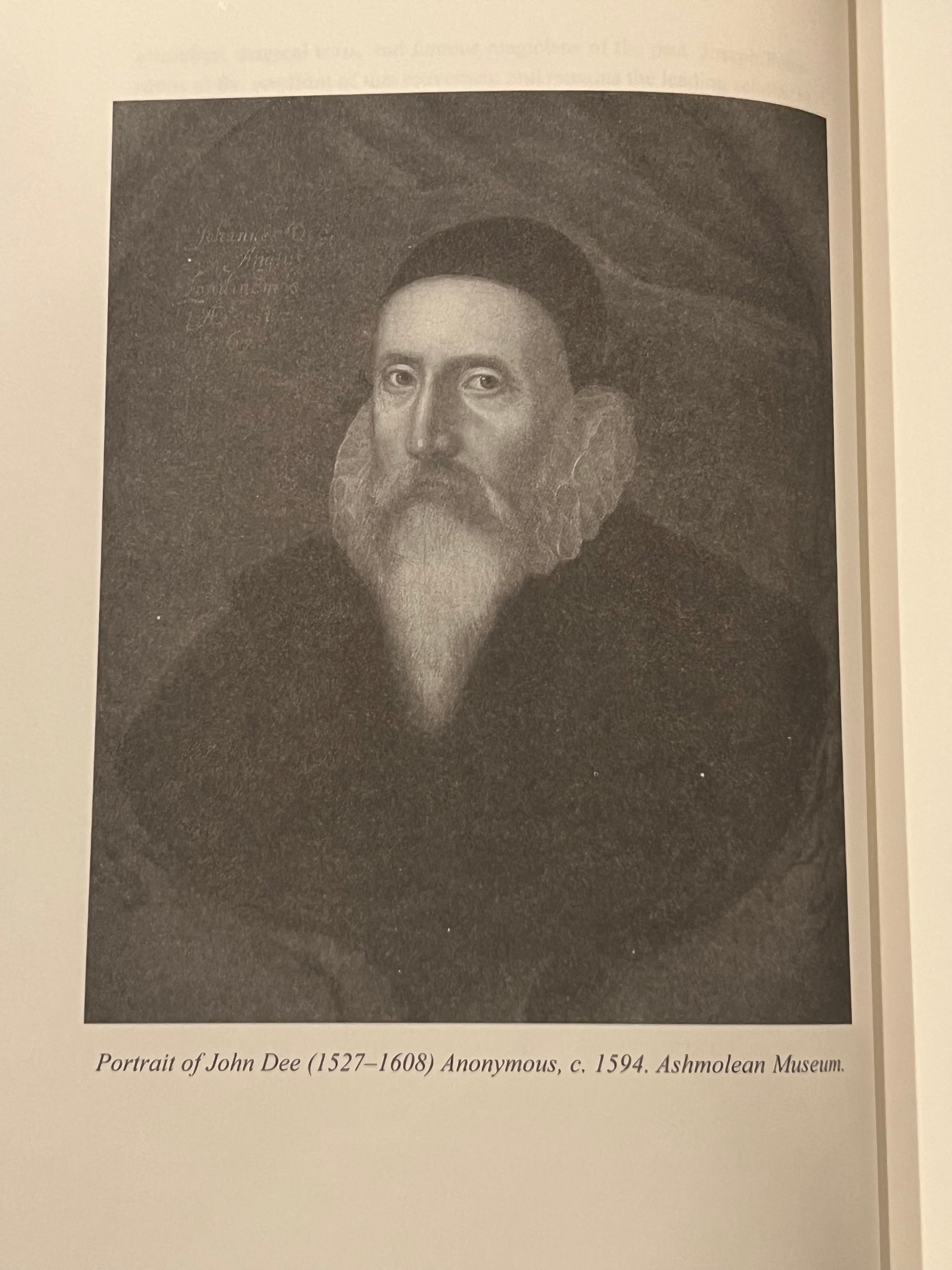 A printed book or catalog page showing a grayscale historical portrait of John Dee with a caption underneath reading 'Portrait of John Dee (1527-1608) Anonymous, c. 1594.