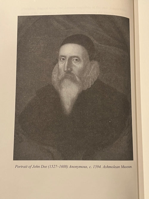 A printed book or catalog page showing a grayscale historical portrait of John Dee with a caption underneath reading 'Portrait of John Dee (1527-1608) Anonymous, c. 1594.