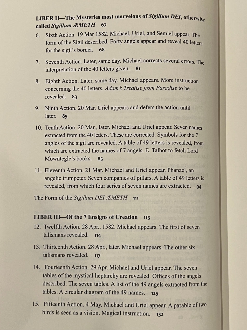 A printed page from a book or booklet showing two columns of text with numbered paragraphs and footnotes, photographed against an off-white background.