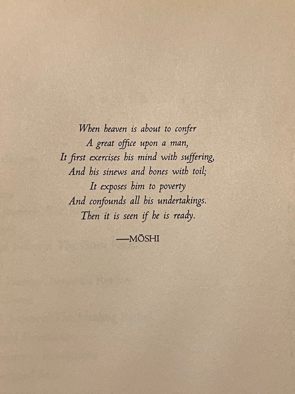 A square print or card featuring a black serif poem attributed to Moshi, centered on a warm beige textured background.