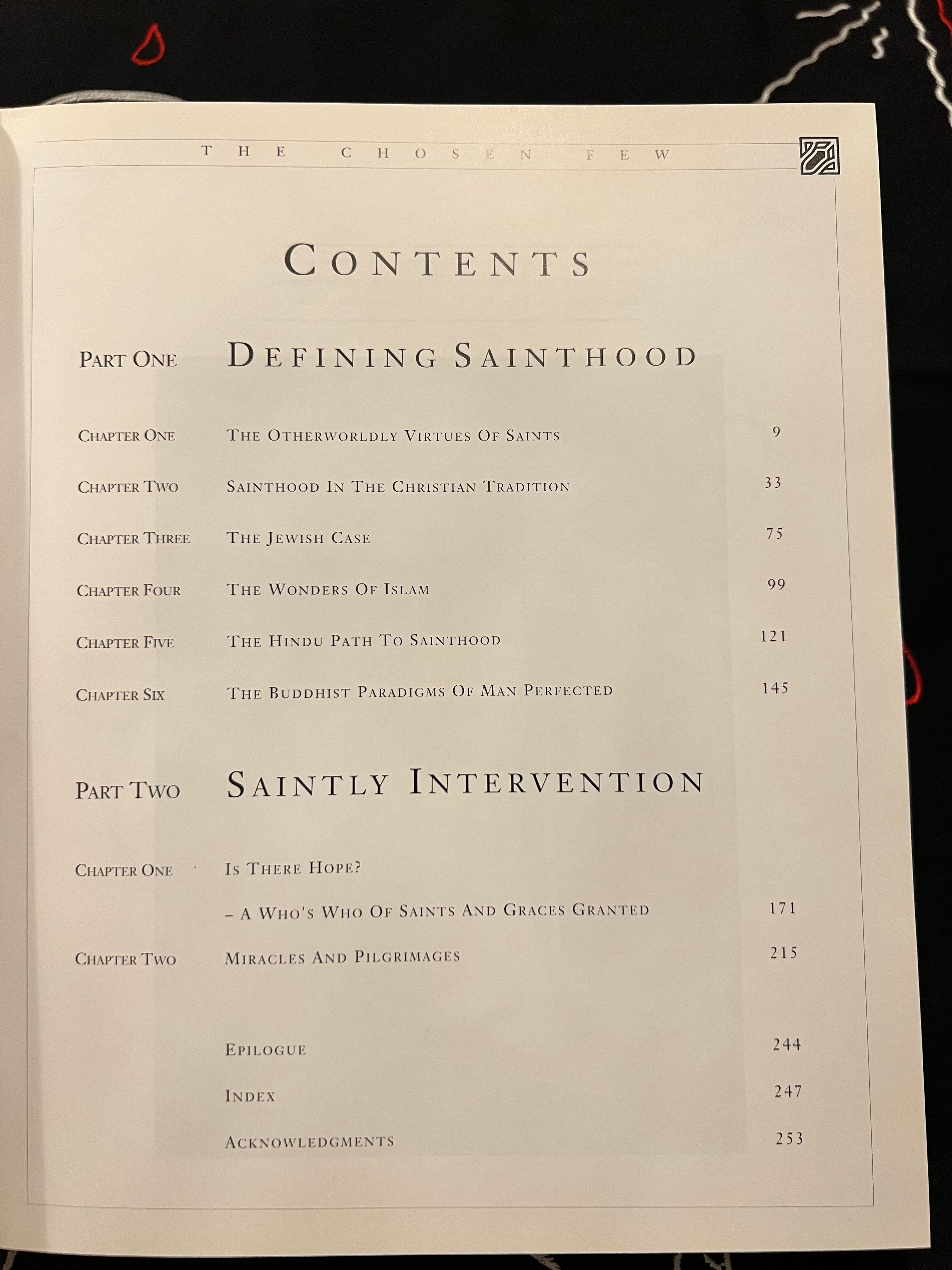 An open book showing the table of contents page from 'The Chosen Few', featuring black text on an off-white page against a dark background.