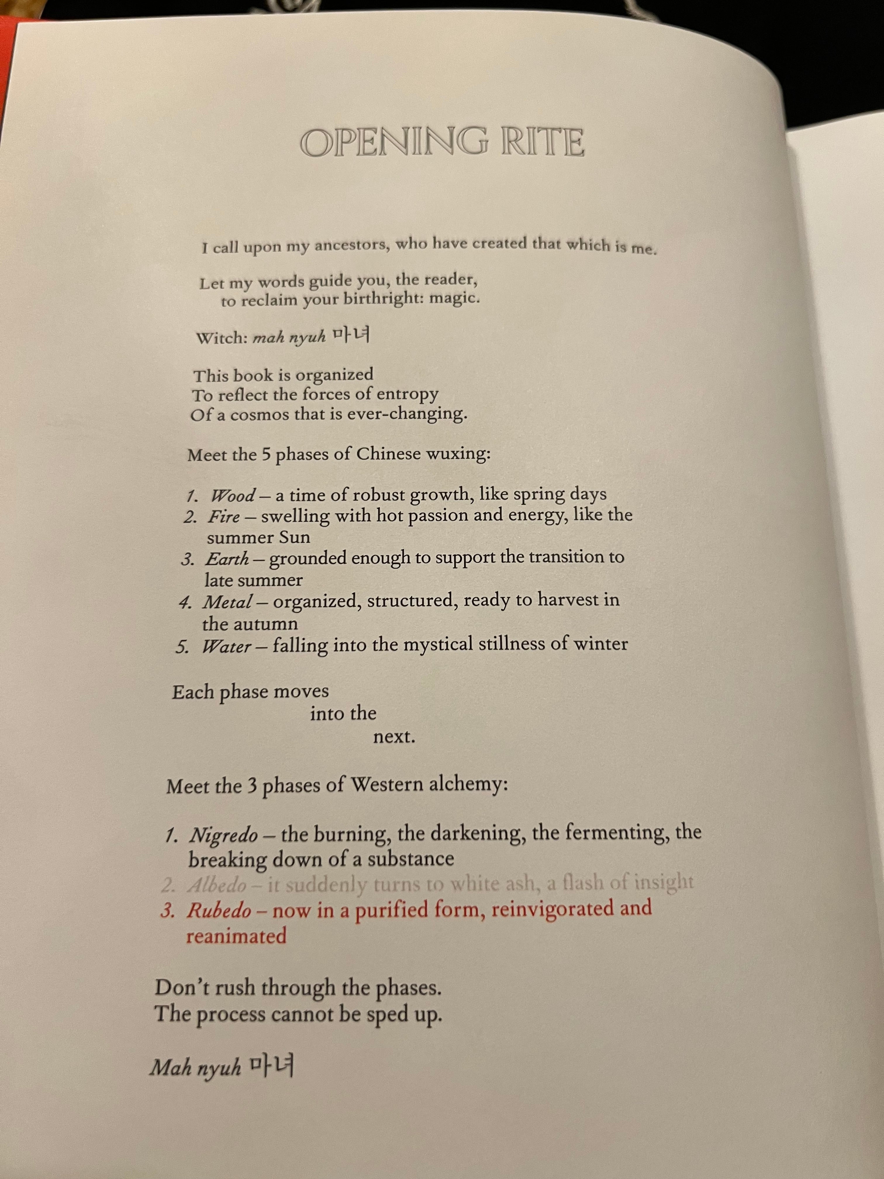 A printed page from a book titled 'OPENING RITE' with black text on an off-white page, photographed from above with the book open. The page includes headings, instructions, and bullet points related to an opening rite.