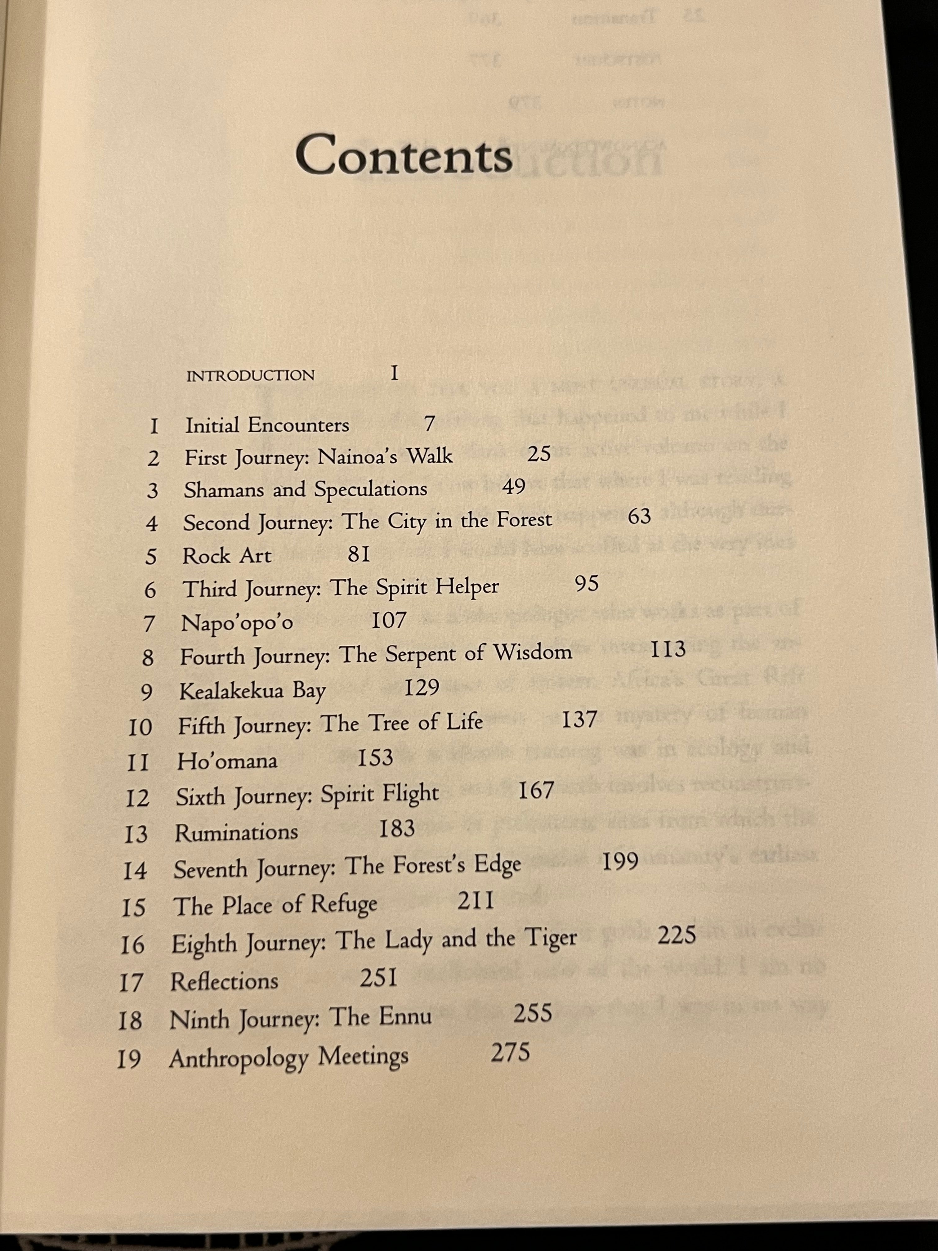 A printed book or booklet contents page with black text on an off-white page, photographed against a dark background.