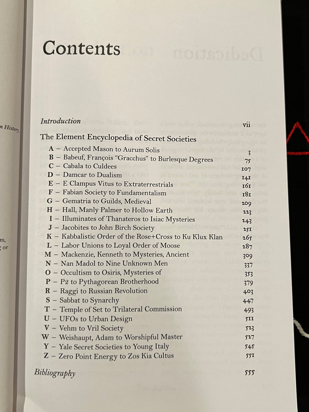 A printed table of contents page from a book or booklet, showing chapter and section headings with page numbers. The page is photographed against an open book, with part of the left page visible at the left edge.