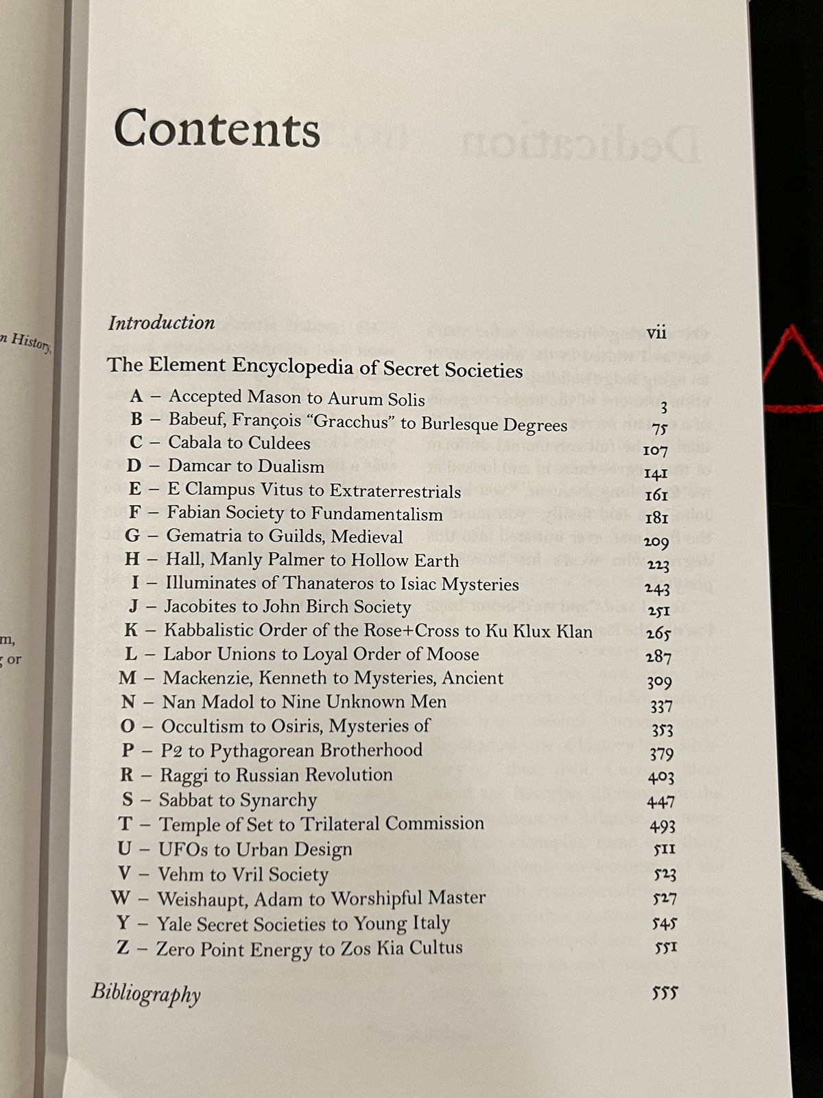 A printed table of contents page from a book or booklet, showing chapter and section headings with page numbers. The page is photographed against an open book, with part of the left page visible at the left edge.