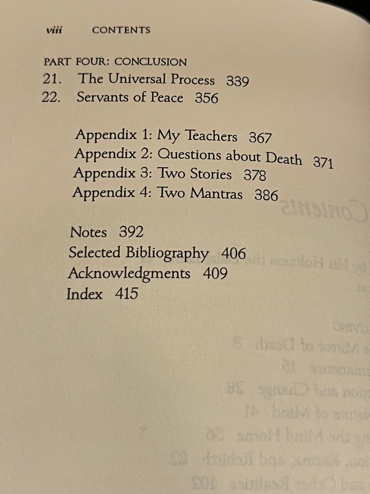 A close-up of a printed book or booklet table of contents page with black text on an off-white page, including section headings, appendix titles, page numbers, and notes.